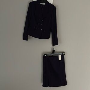 Tahari suit jacket & skirt plum color 
Size 4 
Smoke free & pet free house